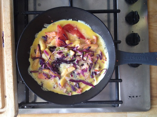 Pour eggs over chips and salad combo